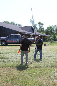Venture 8 crew assessing a project site. septic inspections